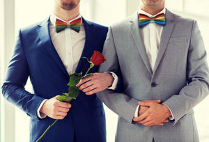 Gay Couple wearing rainbow bow ties