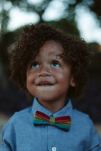 Load image into Gallery viewer, Young Boy Wearing a Rainbow Bow Tie, Photography by https://www.instagram.com/theafricanbazzar/